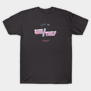 She/They Pronouns (round) T-Shirt